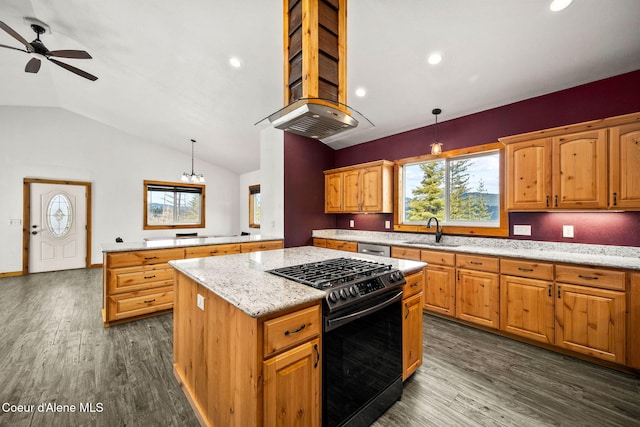 kitchen with dark wood finished floors, a kitchen island, range with gas cooktop, and a sink