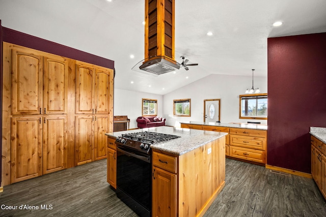 kitchen featuring lofted ceiling, light stone counters, a center island, gas range, and dark wood-style flooring