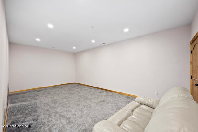 carpeted living room featuring recessed lighting and baseboards