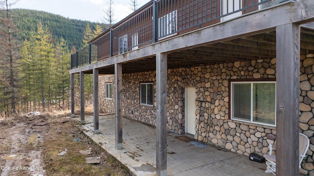 view of patio featuring a forest view