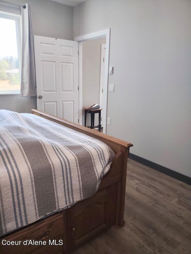 bedroom featuring dark hardwood / wood-style floors