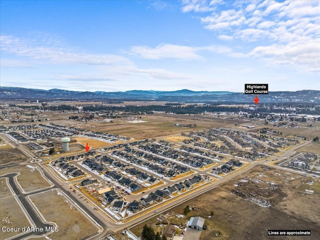 drone / aerial view featuring a mountain view