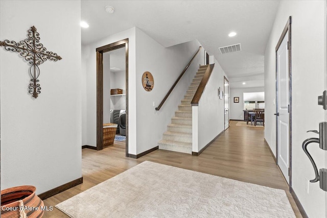 foyer with light hardwood / wood-style flooring