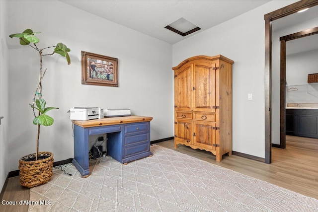 office featuring sink and light hardwood / wood-style flooring