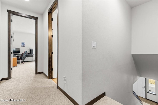 hallway with light hardwood / wood-style flooring