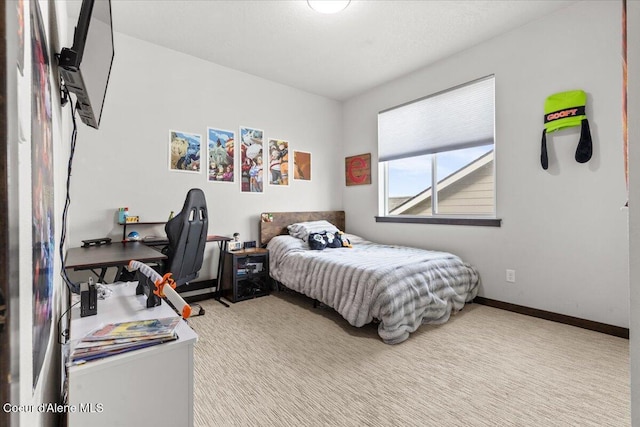 bedroom featuring light carpet