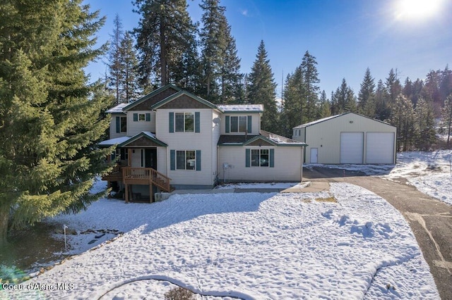 front of property featuring a garage and an outdoor structure