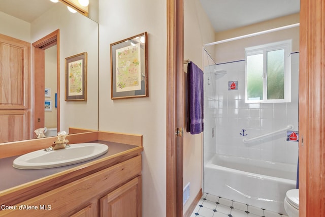 full bathroom with shower / tub combination, vanity, and toilet