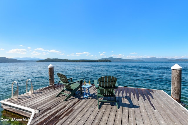 dock area with a water and mountain view