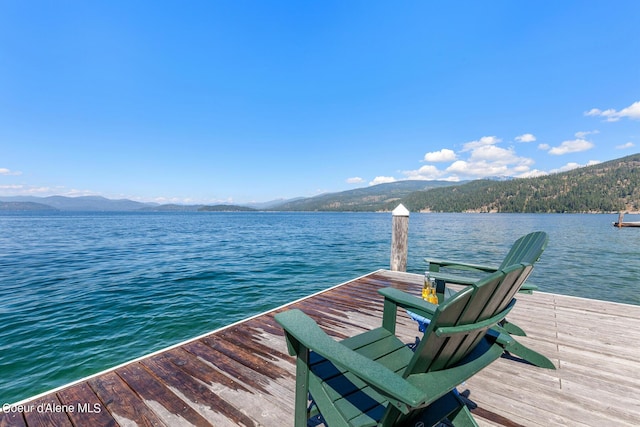 dock area featuring a water and mountain view