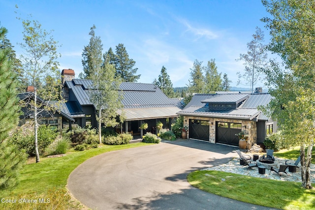 view of front of house with an outdoor fire pit