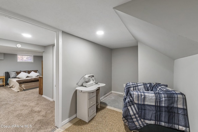 carpeted bedroom featuring lofted ceiling