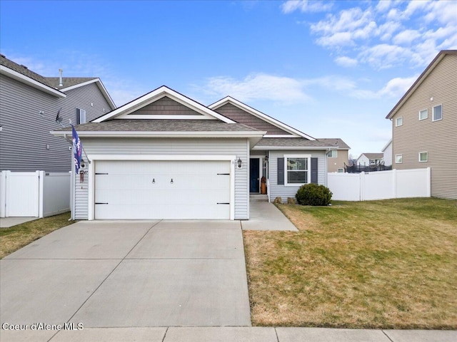 view of front facade with a front yard and a garage