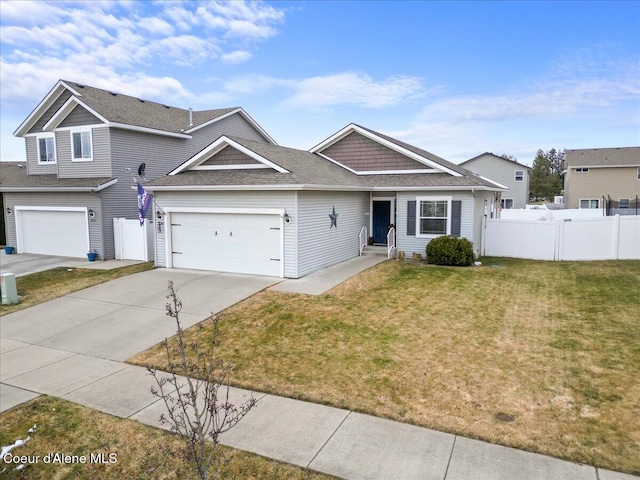 view of front of house with a garage and a front yard