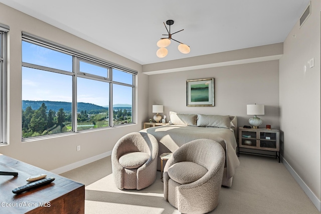 bedroom featuring a mountain view and carpet floors