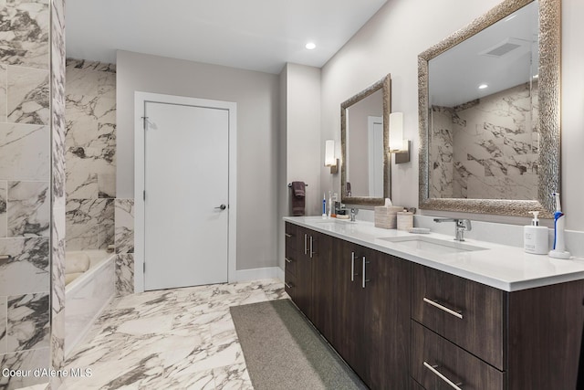 bathroom featuring vanity and separate shower and tub