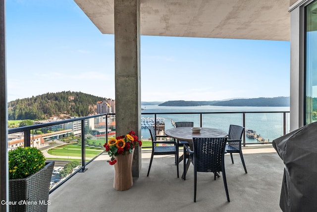 balcony with a water and mountain view