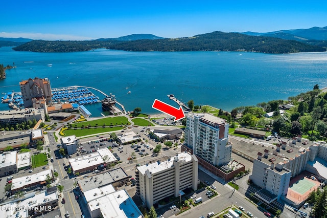 aerial view featuring a water and mountain view