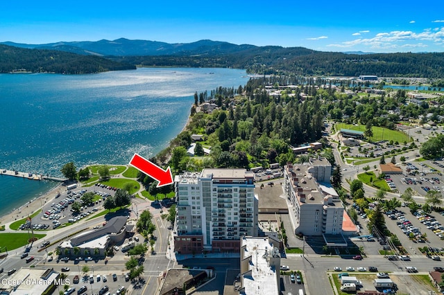 bird's eye view with a water and mountain view