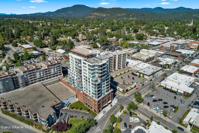 birds eye view of property with a mountain view