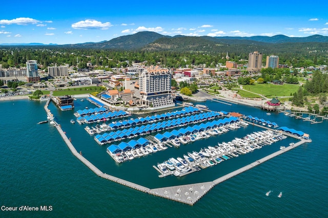 bird's eye view with a water and mountain view