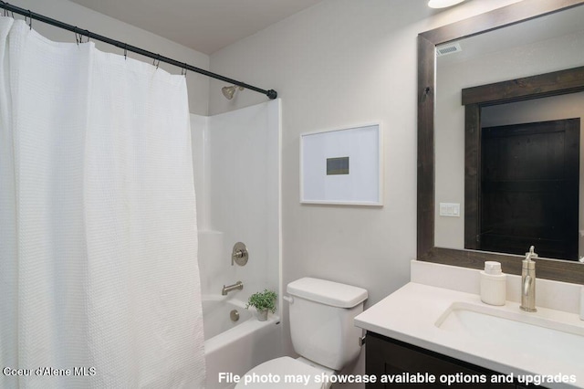 full bathroom featuring vanity, toilet, and shower / bath combo with shower curtain