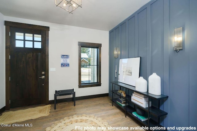 foyer entrance featuring wood-type flooring