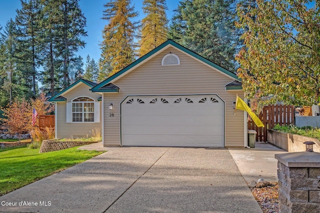 ranch-style house with a garage and a front yard