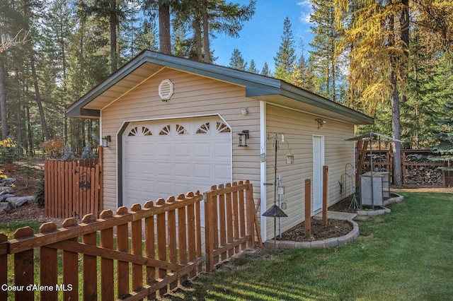 garage featuring a lawn