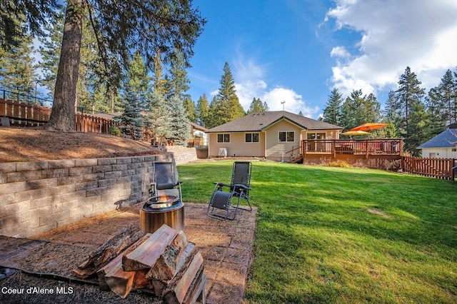 view of yard featuring a wooden deck