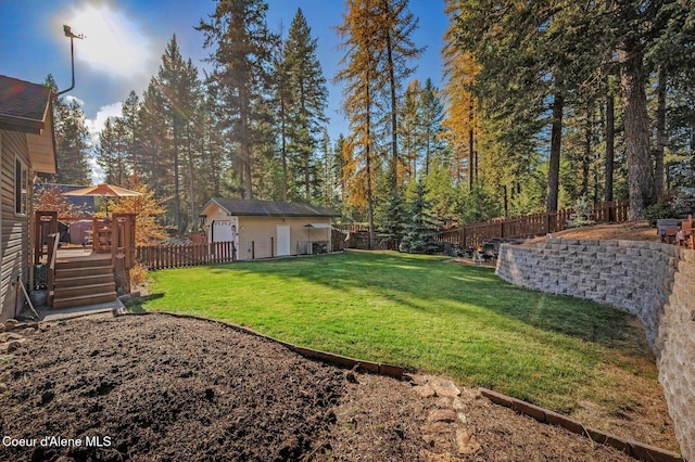 view of yard with an outdoor structure and a deck