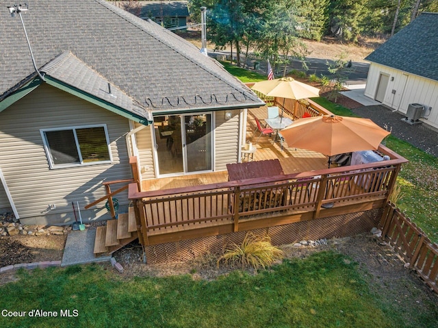 rear view of property featuring a wooden deck