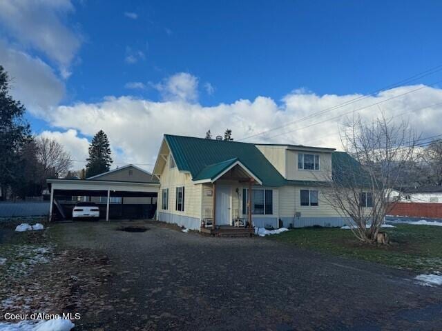view of front of property with a carport