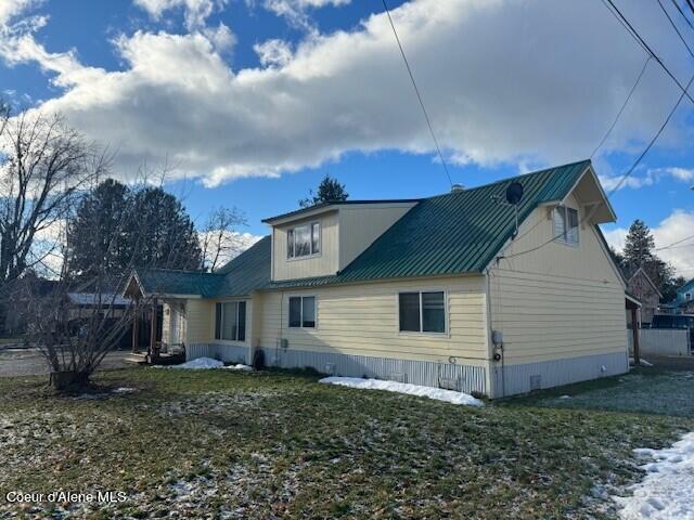 back of property with a yard