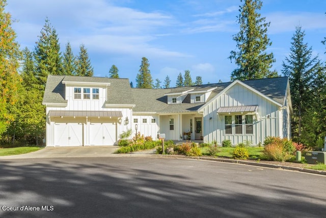 modern inspired farmhouse featuring a garage