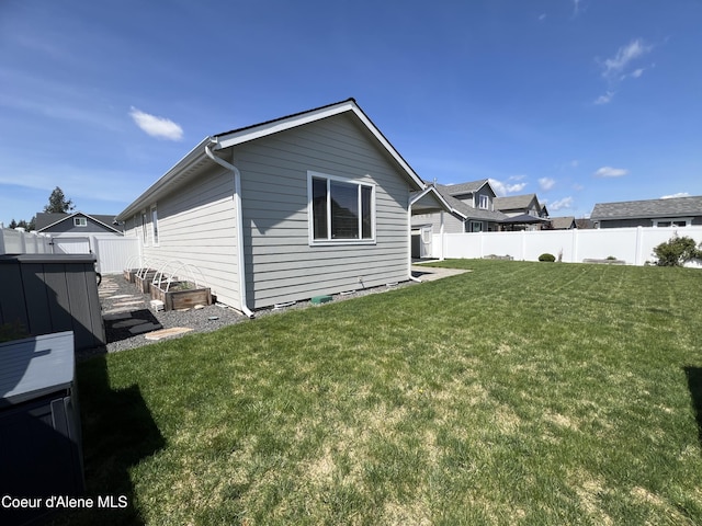 9256 Gettys Ln, Hayden, ID 83835 - rear view of property with fence and a yard