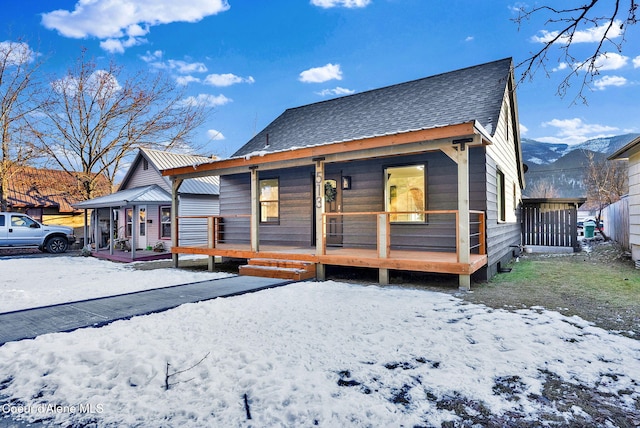 bungalow-style house featuring a mountain view and covered porch