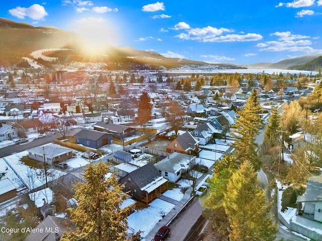 snowy aerial view featuring a mountain view