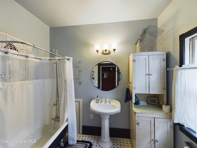 bathroom with shower / tub combo