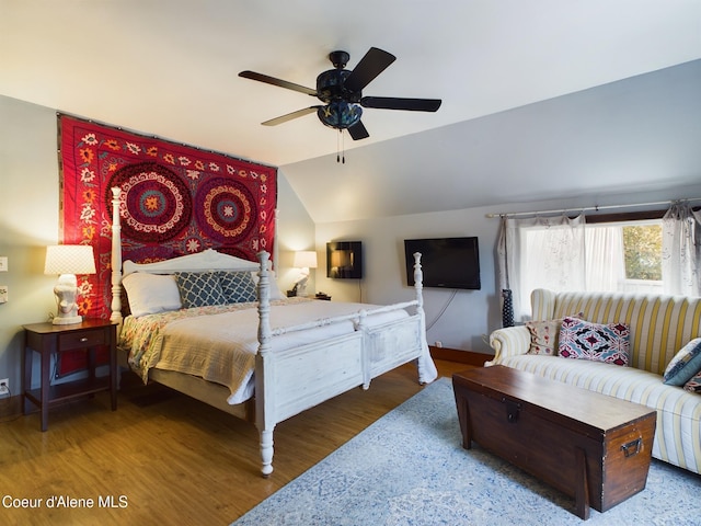 bedroom with lofted ceiling, wood-type flooring, and ceiling fan