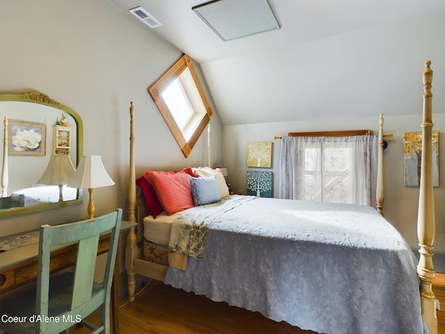 bedroom featuring vaulted ceiling and dark wood-type flooring