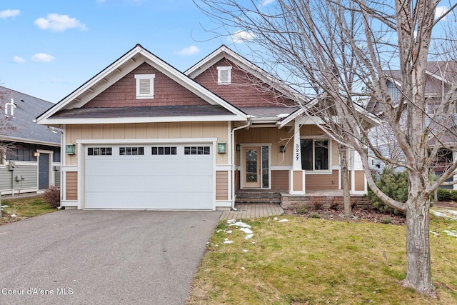 craftsman-style house with a front yard