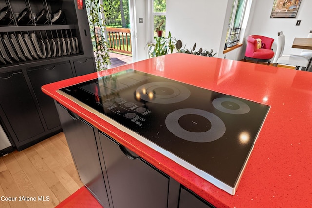 interior space with black electric stovetop and light wood-type flooring