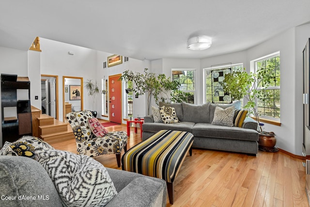 living room with a healthy amount of sunlight and light wood-type flooring