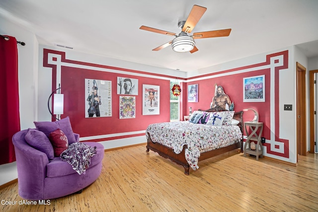 bedroom with hardwood / wood-style flooring and ceiling fan