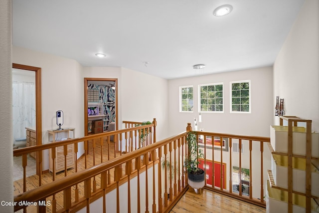 hallway with light hardwood / wood-style flooring