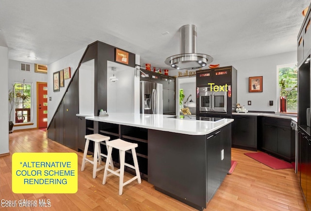 kitchen with stainless steel fridge with ice dispenser, a kitchen bar, island exhaust hood, kitchen peninsula, and light hardwood / wood-style flooring