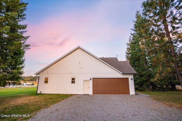 property exterior at dusk featuring a garage