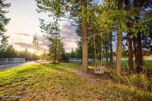 view of yard at dusk