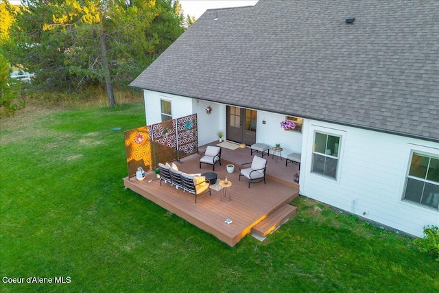 deck with outdoor lounge area and a lawn